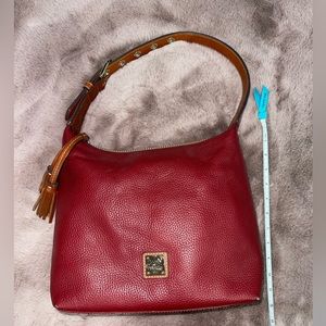 Dooney & Bourke. Burgundy pebble grain leather.